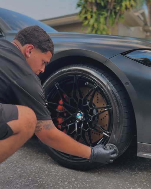 Precisionn Detailing specialist cleaning a BMW wheel