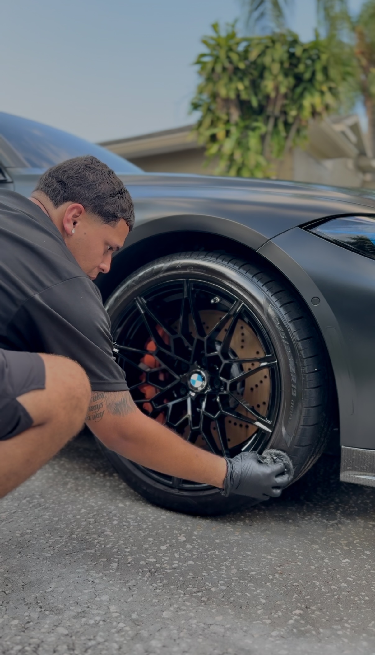 Precisionn Detailing specialist carefully finishing a BMW wheel